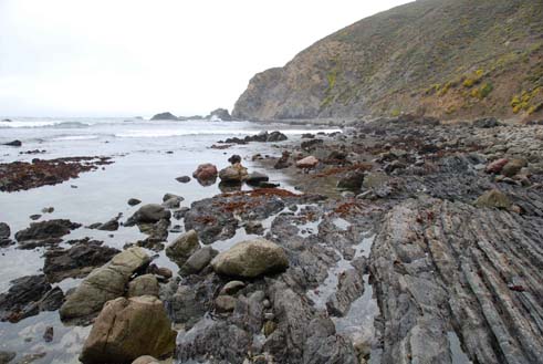 View of an ocean and a rocky shore.