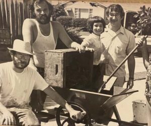An early photo of Sacramento Home Winemakers crushing grapes